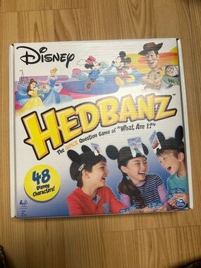Disney Hedbanz Game Box – White with Yellow Logo and Multicolor Art